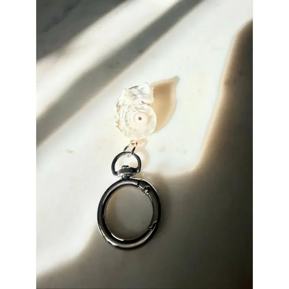 Pearlescent with silver color seashell keychain